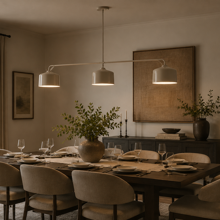 Large architectural bronze chandelier sized correctly above a dining table in a luxury dining room