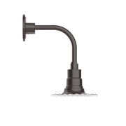 Curved arm wall light with dark bronze finish and cylindrical shade