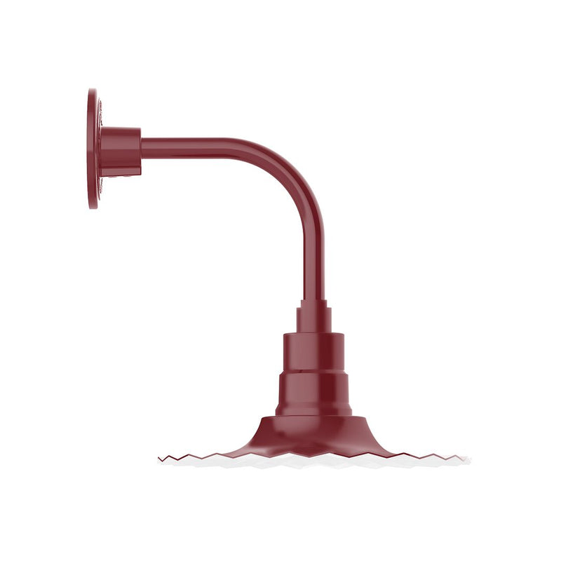 Barn red curved arm wall light with round mounting plate and cylindrical body