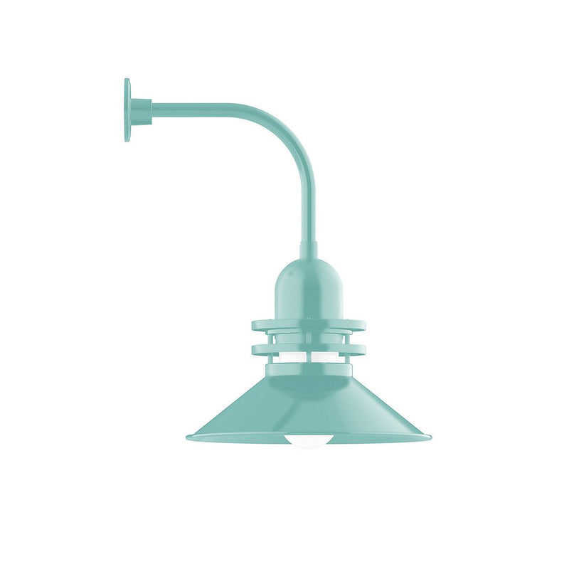 Sea green curved arm wall light with flared shade and round wall mount