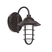 Bronze wall-mounted lantern light with glass shade and curved guard