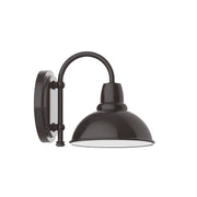 Architectural bronze wall sconce with arched support and dome shade