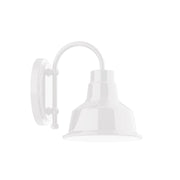 White wall light sconce with arched arm and bell-shaped shade