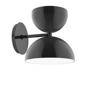 Black wall sconce with two dome shades and round backplate.