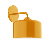 Bright yellow wall sconce with arched arm and dome shade