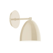 Cream LED wall sconce with round backplate and dome shade