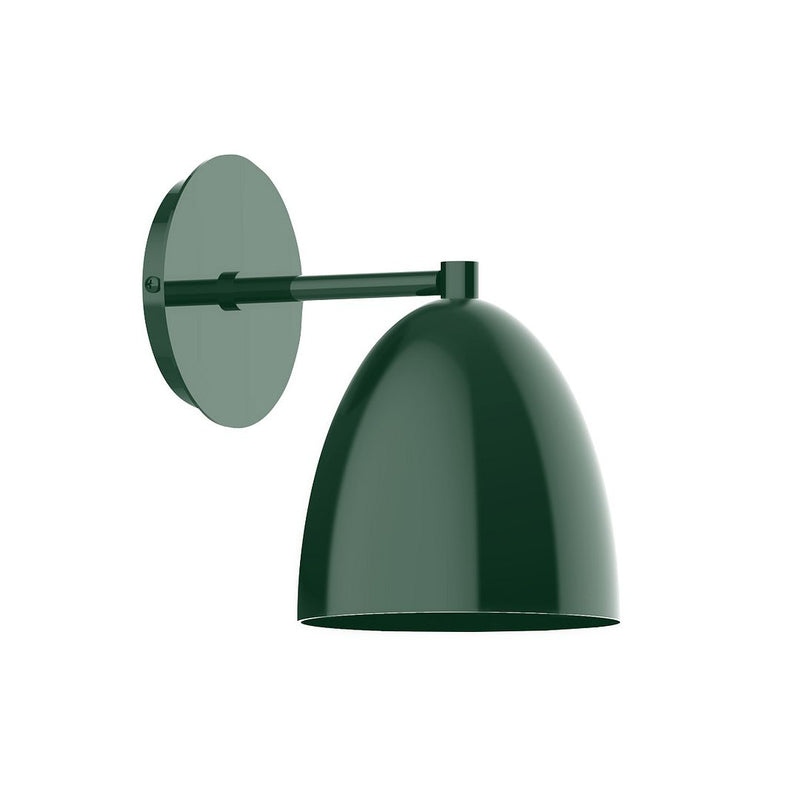 Forest green wall sconce with round backplate and angled arm holding dome shade