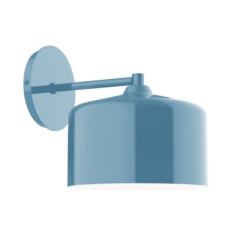 Light blue wall sconce with round backplate and angled cylinder shade, LED design.