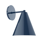 Navy wall sconce with round backplate and conical shade on arm