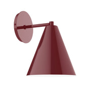 Barn red wall sconce with round backplate and conical metal shade