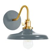 Slate gray wall sconce with brushed brass arm, large dome shade, and exposed bulb