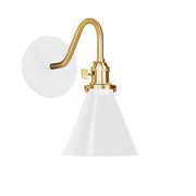 White wall sconce with brushed brass backplate, curved arm, and bell shade