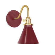 Barn red wall sconce with brushed brass gooseneck and round back plate