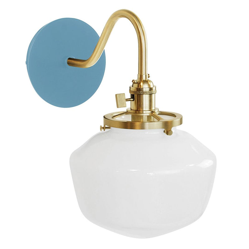 Light blue wall sconce with brushed brass and white glass shade