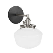 Black wall sconce with brushed nickel hardware and opal glass dome shade
