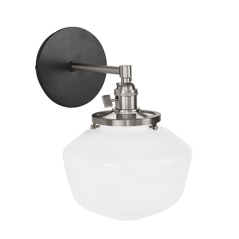 Black wall sconce with brushed nickel hardware and opal glass dome shade