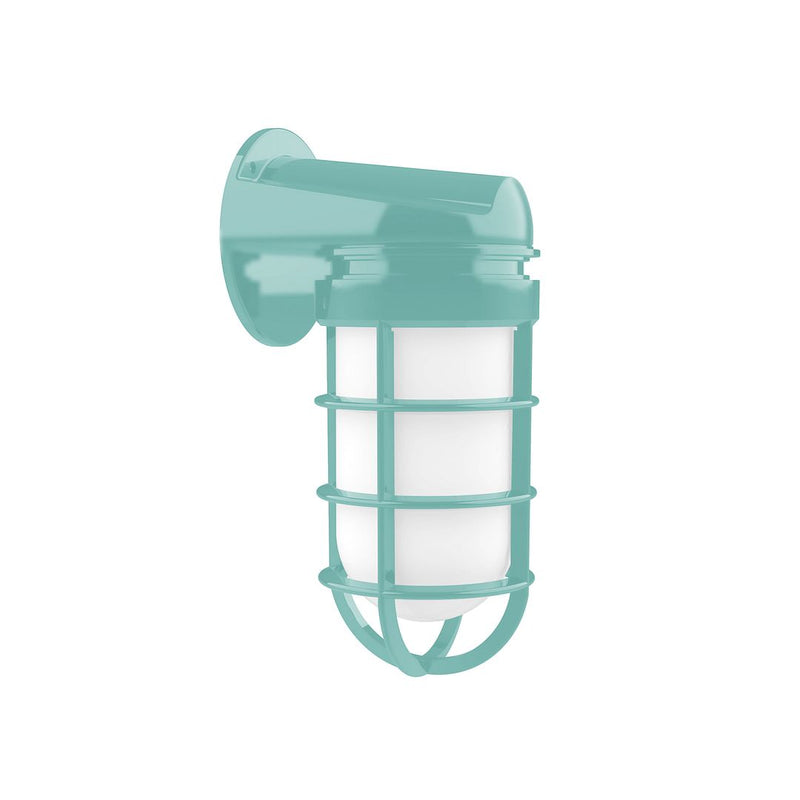 Sea green wall light with cylindrical glass, metal cage, and lantern-style guard