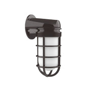 Architectural-style wall light, bronze finish, clear cylindrical glass shade in metal cage.